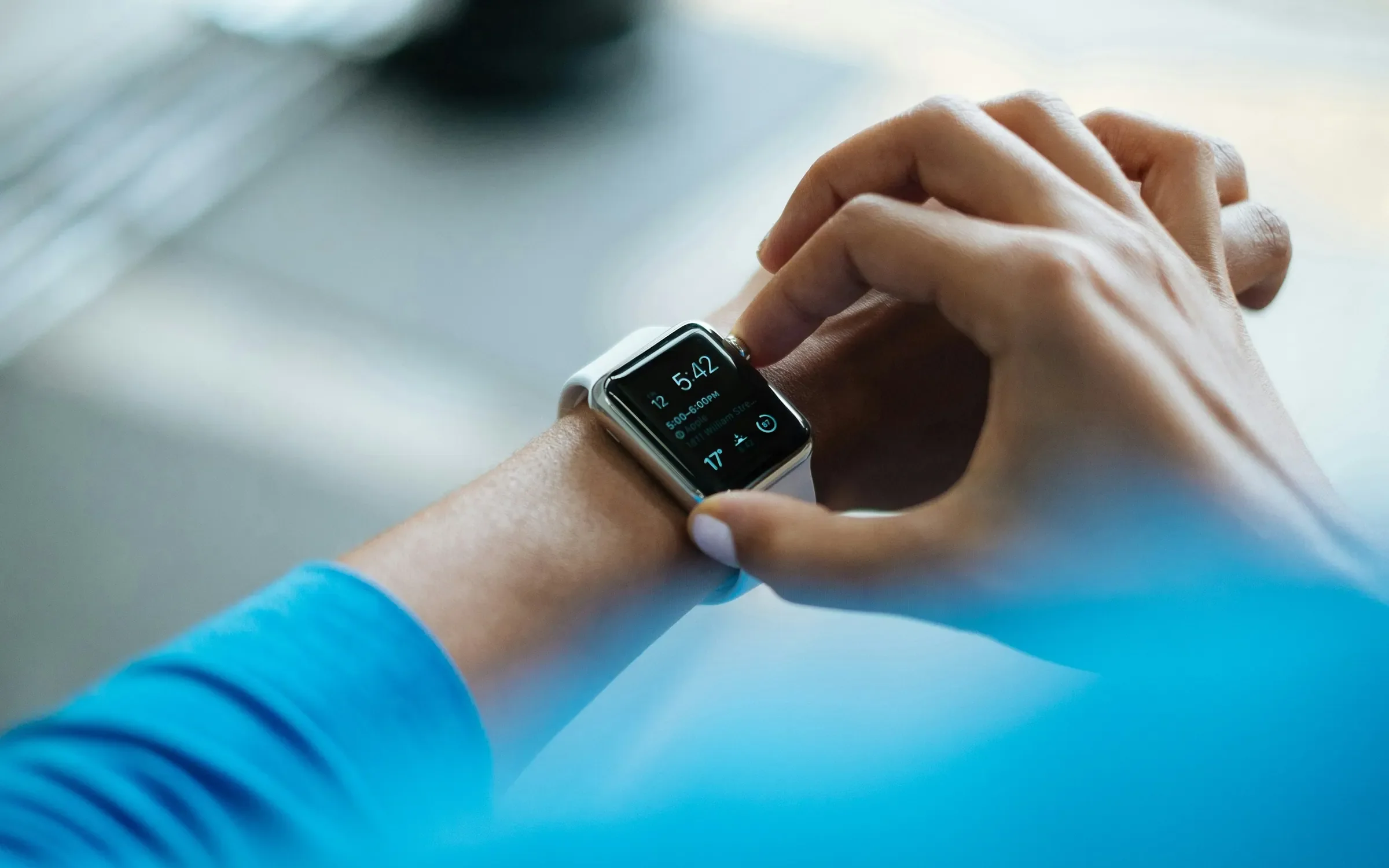 person clicking Apple Watch smartwatch